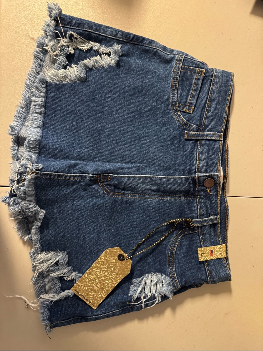 Vibrant Distressed Blue Denim Shorts with Frayed Hem